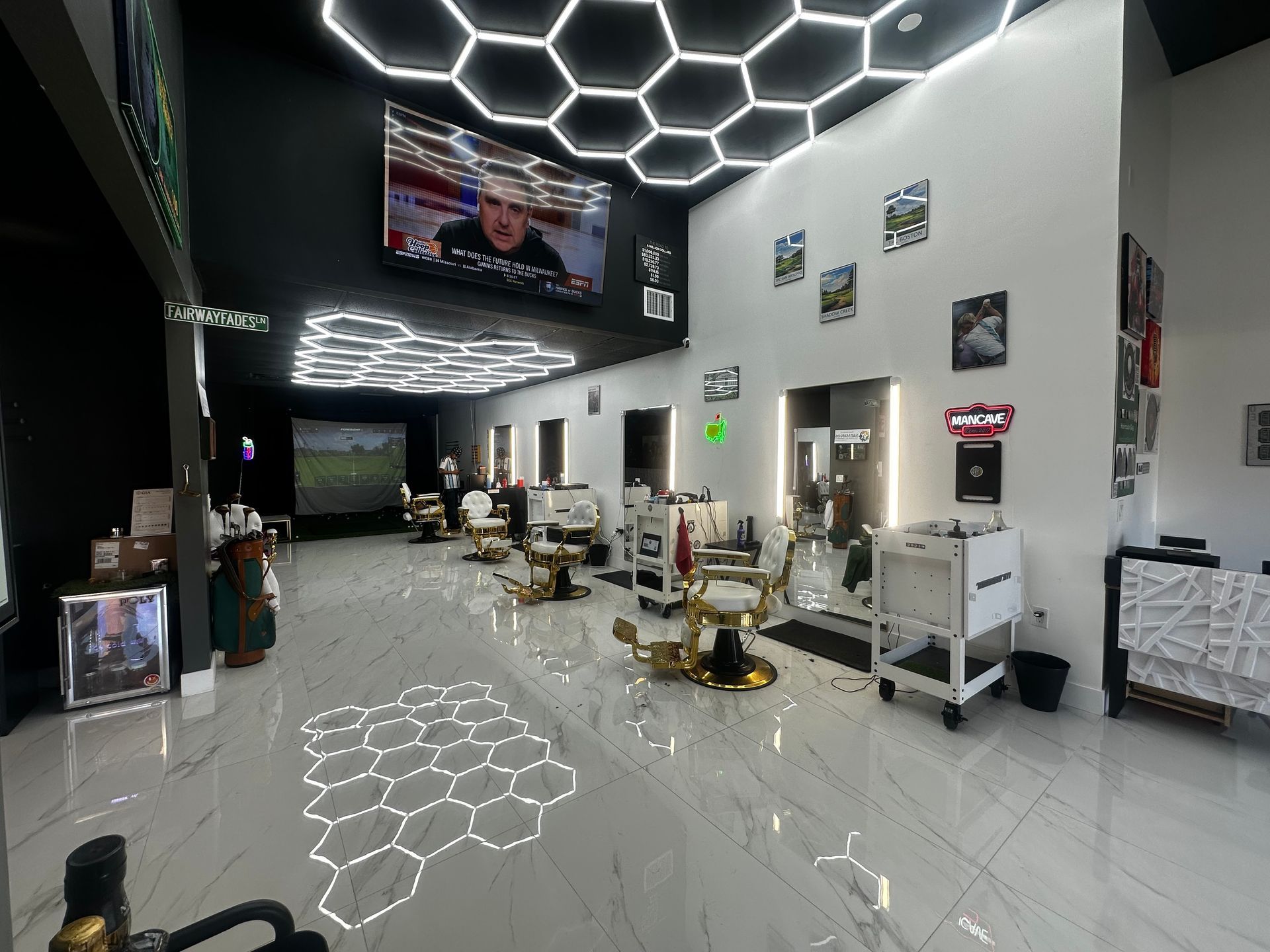 Modern barbershop interior with LED ceiling lights and glossy floors, featuring barber chairs and mirrors