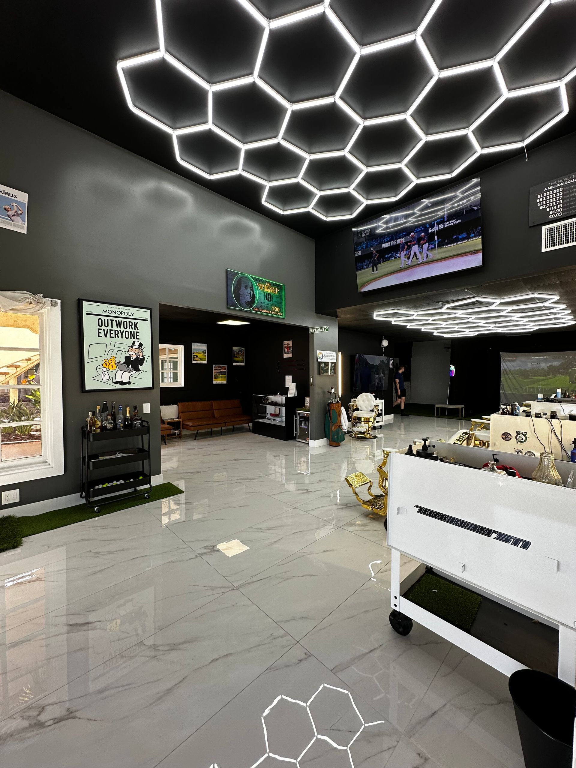 Modern salon interior with hexagon LED ceiling lights, mirrors, and white styling chairs