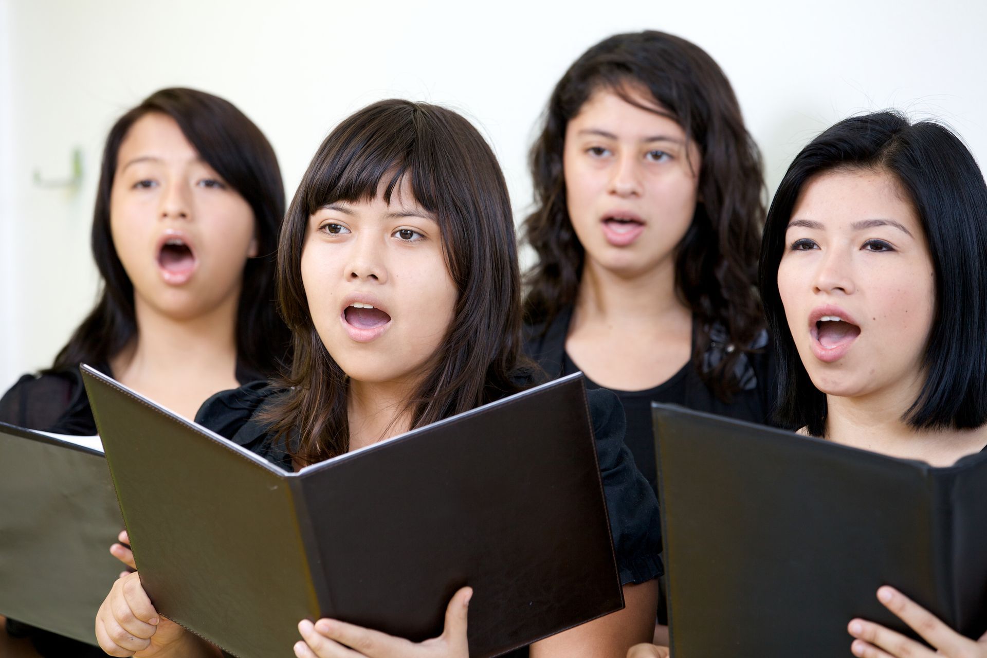 Women Singing While Holding Books — San Diego, CA — Susan Simmons Virtual Voice Lessons