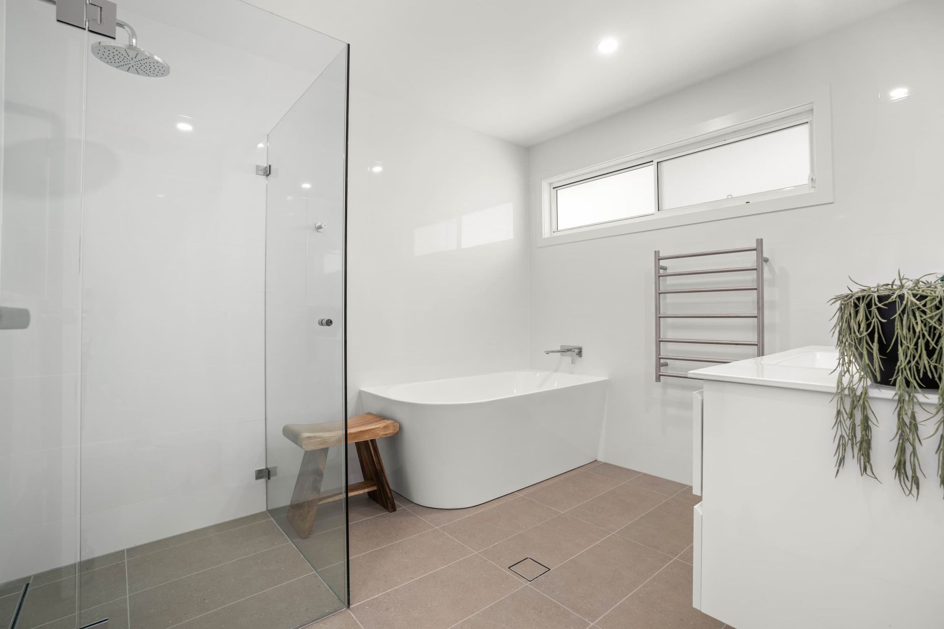 A Bathroom With A Bathtub, Sink, And Shower — Ridgeline Building Co In Gerringong, NSW