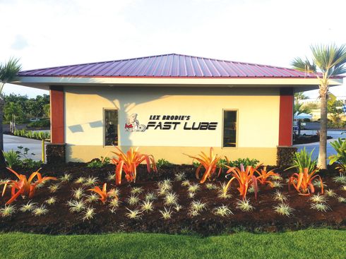 A building with a sign that says fast lube