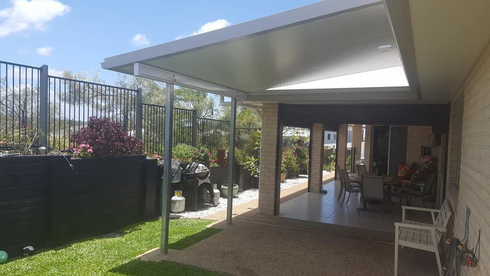 A Patio With a Roof and a Fence in the Backyard of a House — Bob Ryan's Home Improvements & Construction Pty Ltd in Beecher, QLD