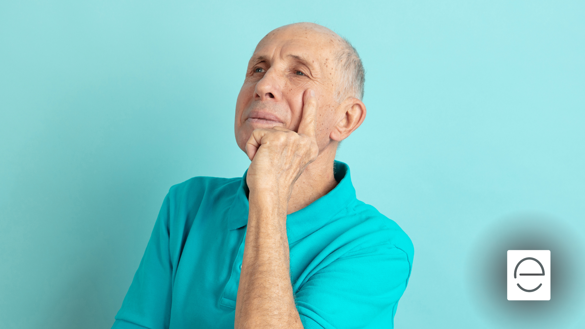 Man in teal shirt, hand on chin, looking upward thoughtfully against a teal background.