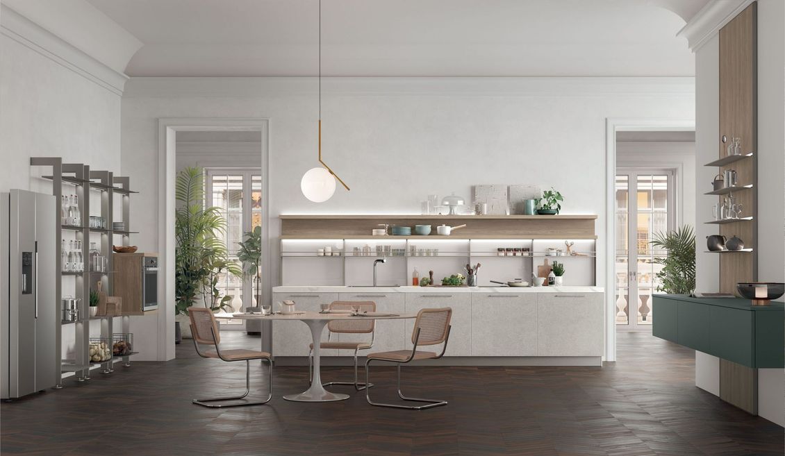 Una cucina con tavolo e sedie