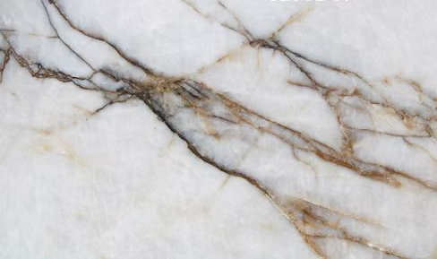 White marble surface with gray and gold veining across it