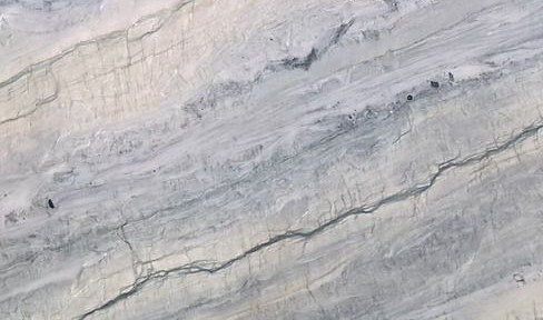 Light gray marble with subtle white and dark veining.