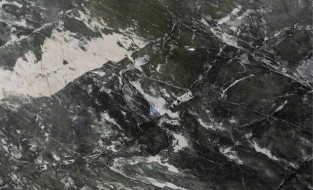 Dark gray and white marbled stone texture with veined patterns