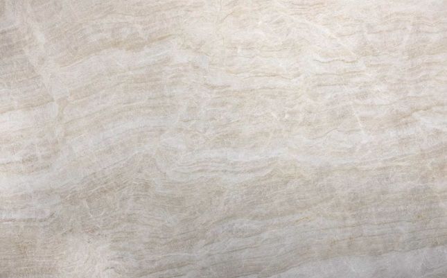 Close-up of a beige textured fabric surface with subtle wavy patterns