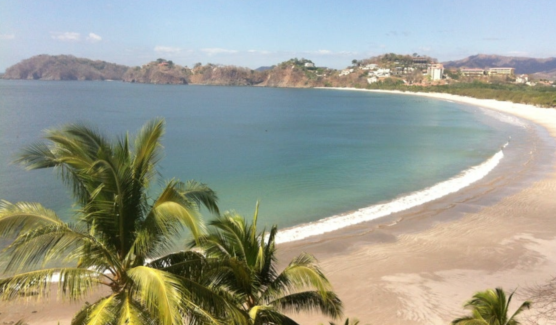 Playa Flamingo bay with tropical beach, palm trees and Pacific Ocean views in Guanacaste Costa Rica.
