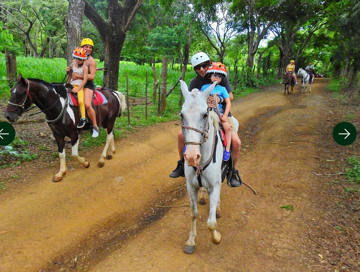 Travelers exploring tropical trails during a horseback riding excursion in Guanacaste Costa Rica with local guides