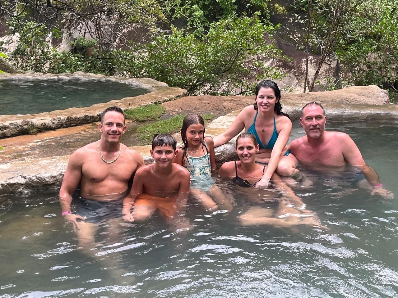 Family enjoying the water during a Mega Combo tour in Guanacaste Costa Rica combining adventure nature and relaxation