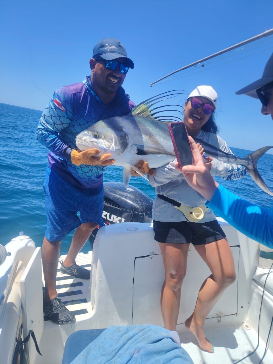 Private fishing charter in Guanacaste, Costa Rica with anglers enjoying a successful catch on the Pa
