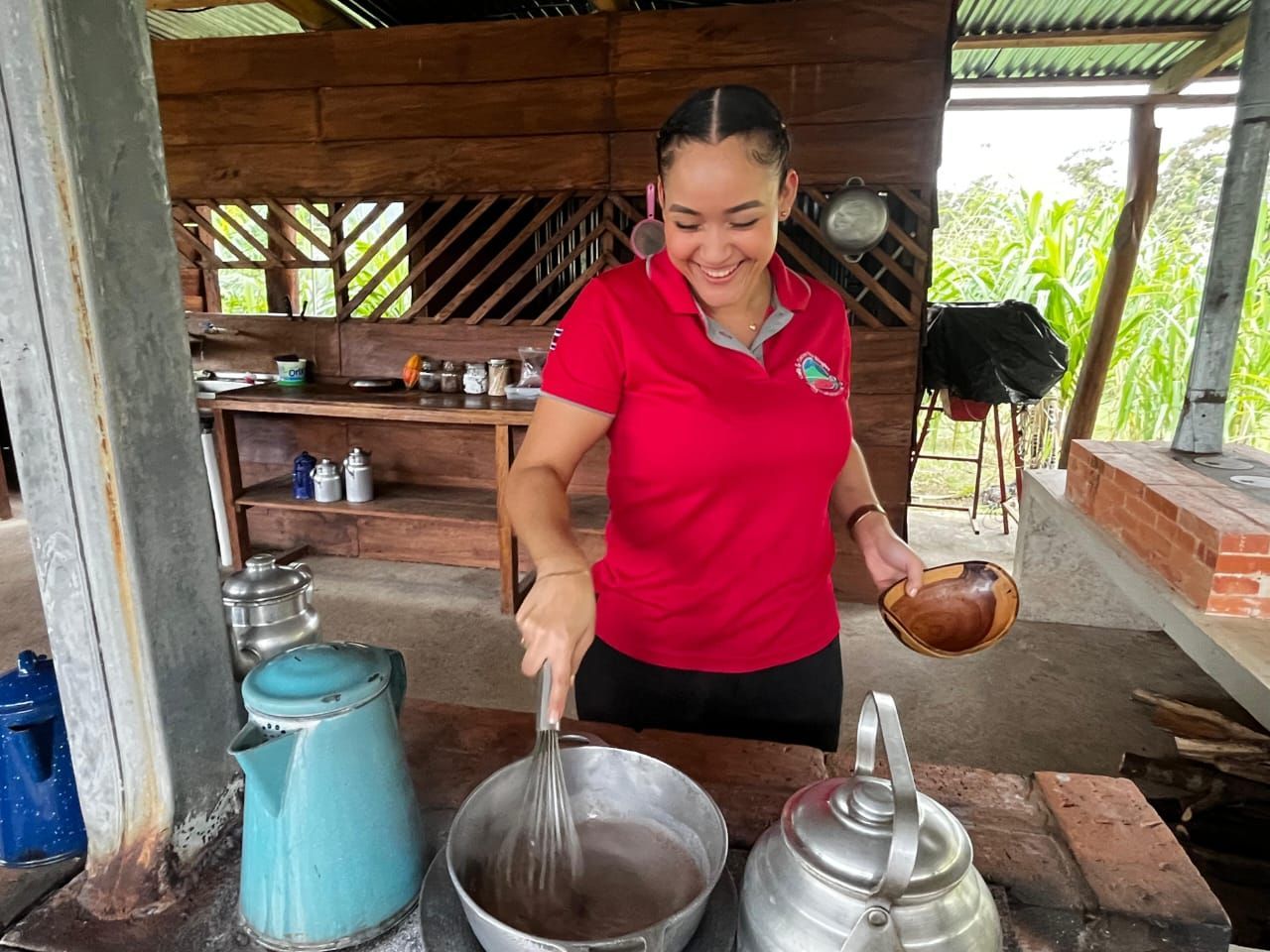 Local host preparing traditional Costa Rican chocolate during a private rainforest wildlife excursion.
