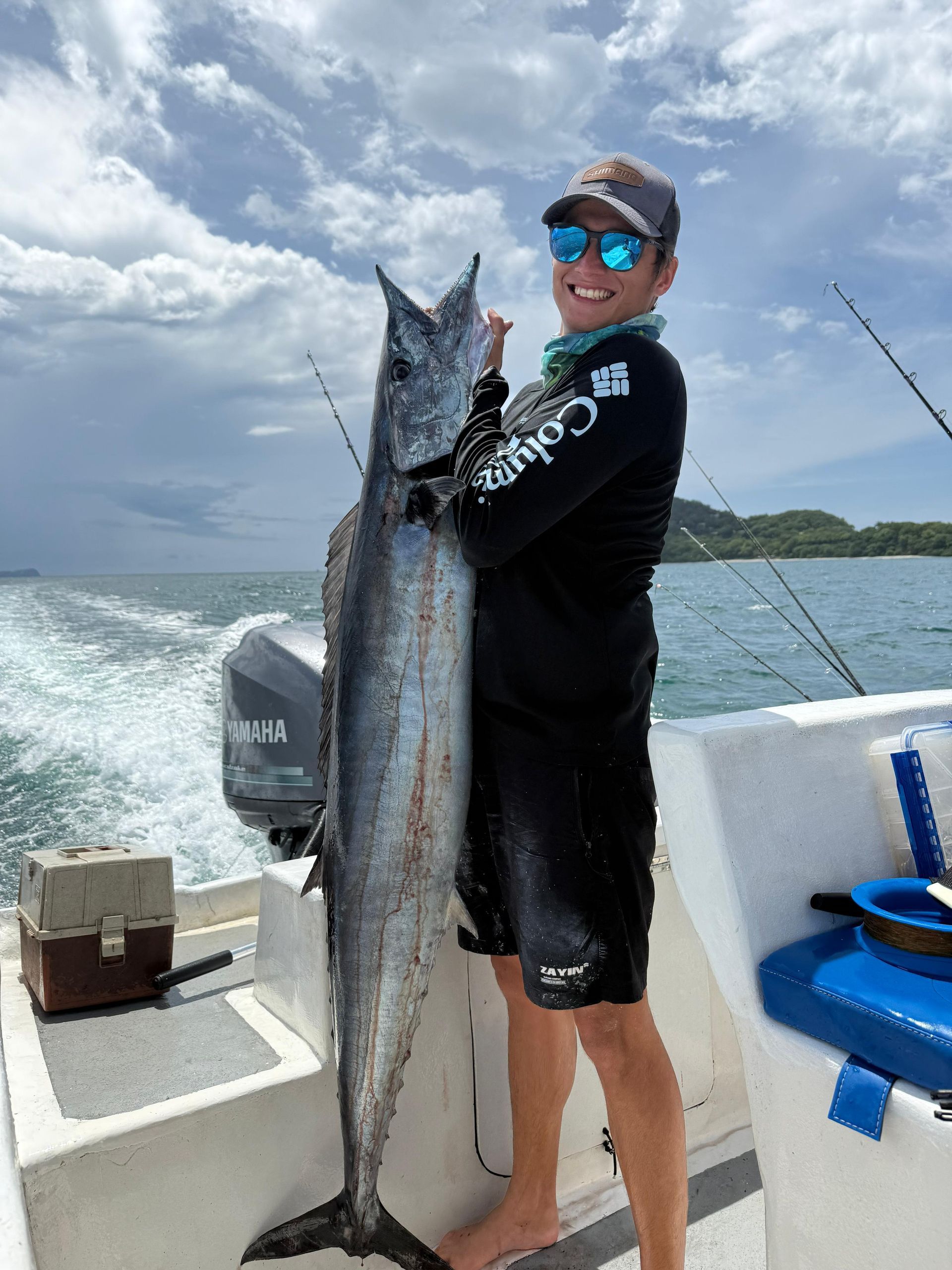 Angler displaying a large offshore catch during a private fishing charter in Guanacaste, Costa Rica.