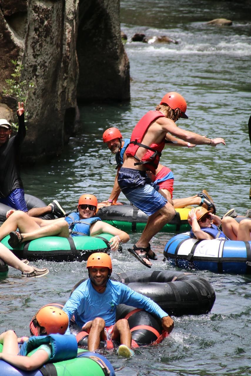 River tubing adventure with travelers during a Mega Combo tour in Guanacaste Costa Rica surrounded by tropical scenery