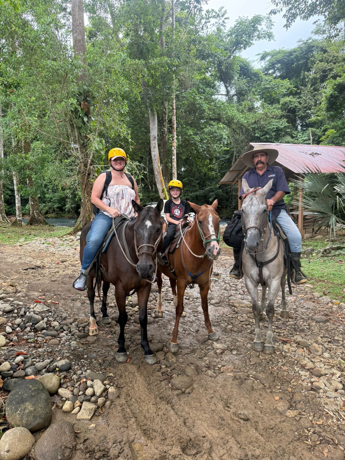 Family horseback riding adventure during a private excursion from Planet Hollywood Costa Rica in Guanacaste