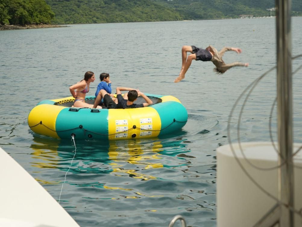 Guests enjoying a water activity during a private catamaran excursion from Andaz Costa Rica along the Guanacaste coast