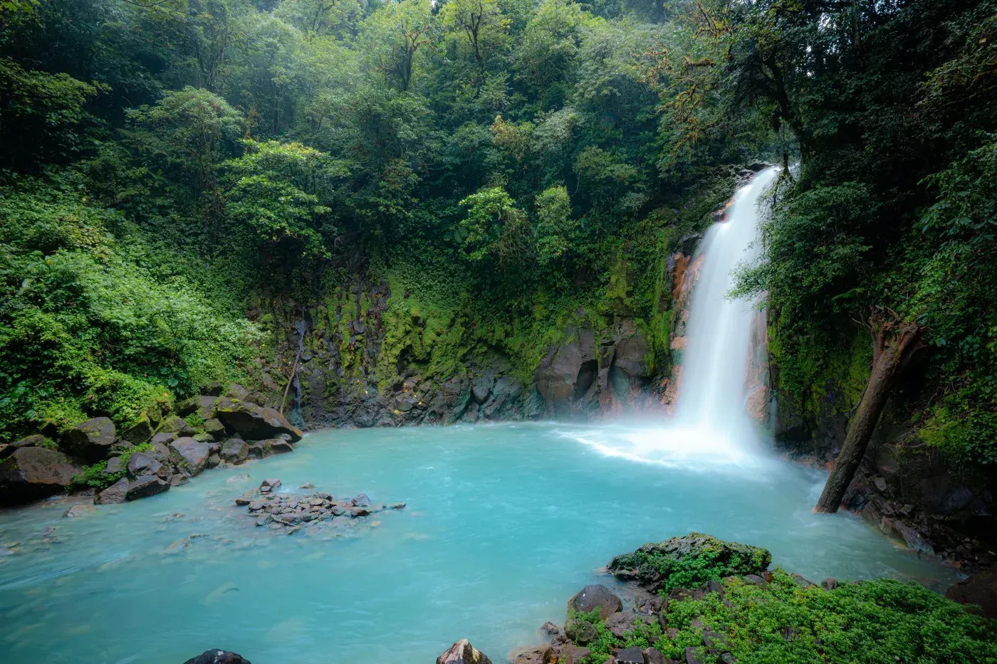 Rio Celeste waterfall and turquoise water during a nature excursion from Tamarindo Costa Rica.