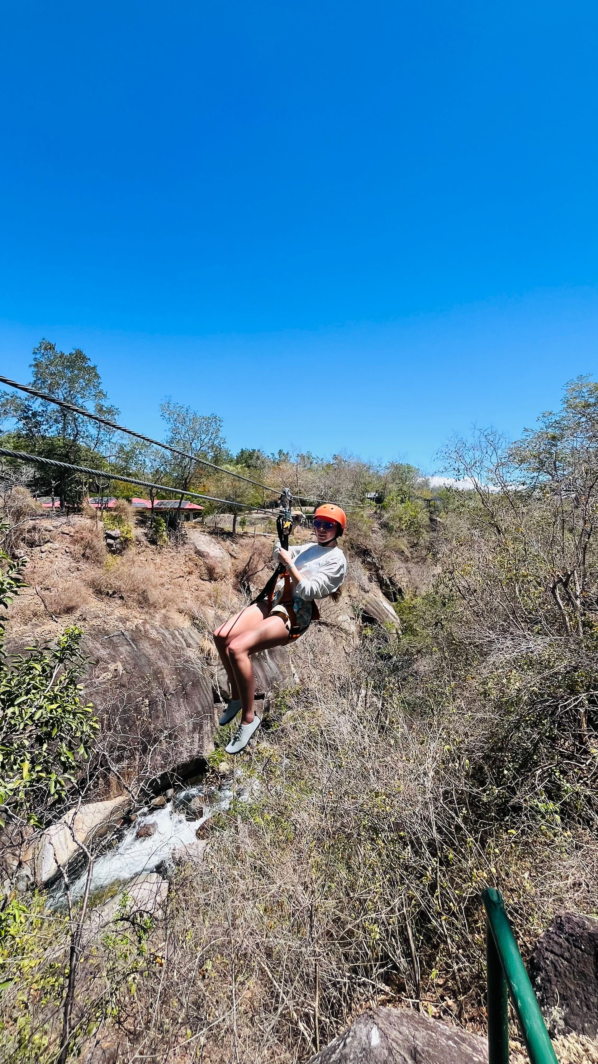 Traveler ziplining during a Mega Combo tour in Guanacaste Costa Rica featuring exciting outdoor adve