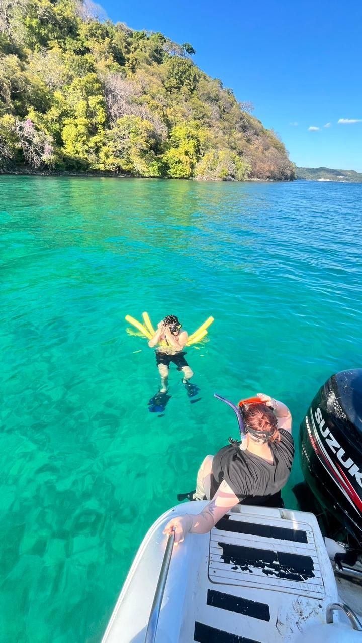 Swimming in crystal clear water during a private boat tour in Guanacaste Costa Rica on the Pacific coast