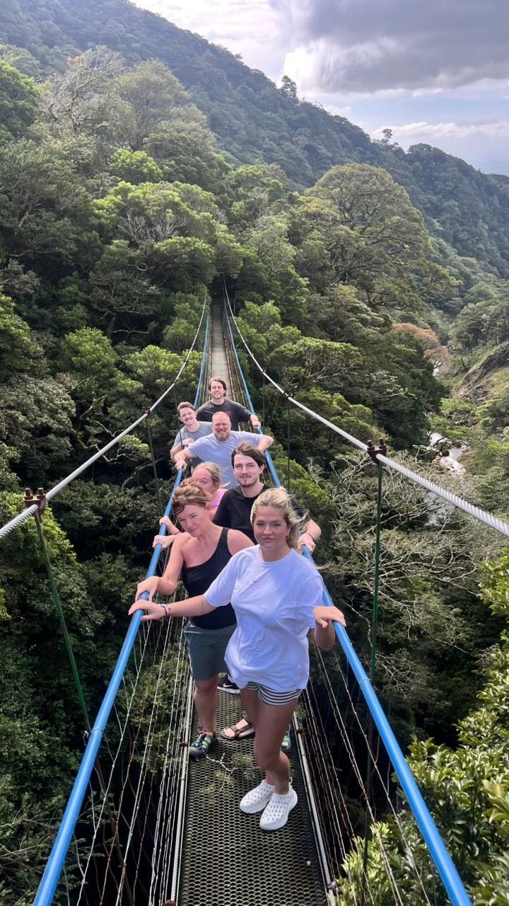 Guests crossing hanging bridges through the rainforest at Miravalles Volcano, Guanacaste, Costa Rica.