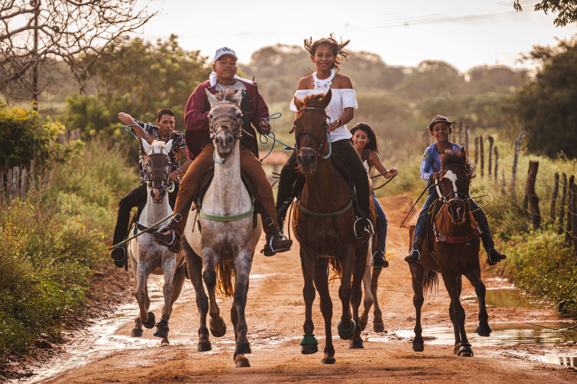 Travelers enjoying a guided horseback riding tour in Costa Rica through scenic countryside and tropical landscapes