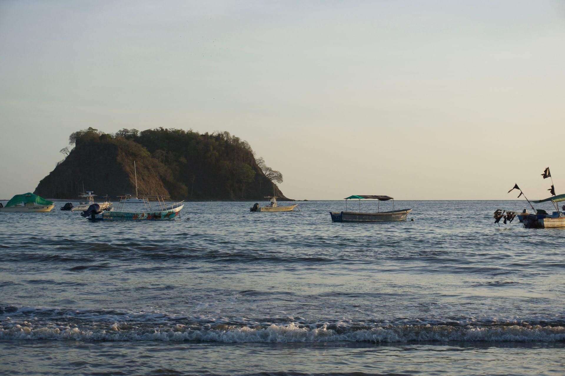 Boats in Playas del Coco bay on the Pacific coast, starting point for private excursions in Guanacaste Costa Rica.