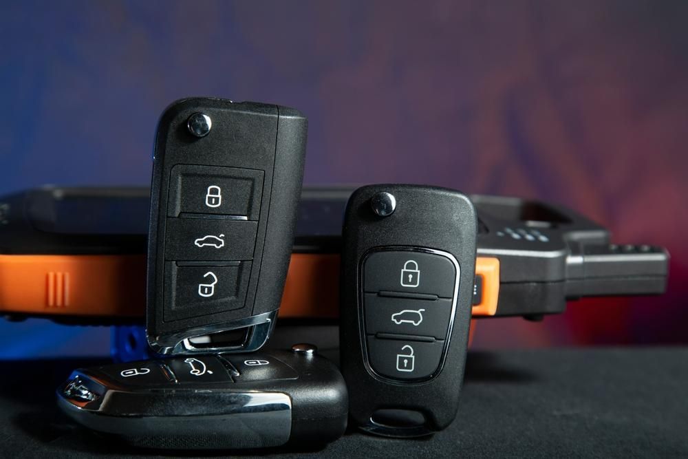 Two Car Keys Are Sitting on Top of Each Other on A Table — Tropical Locksmiths in Gregory River, QLD