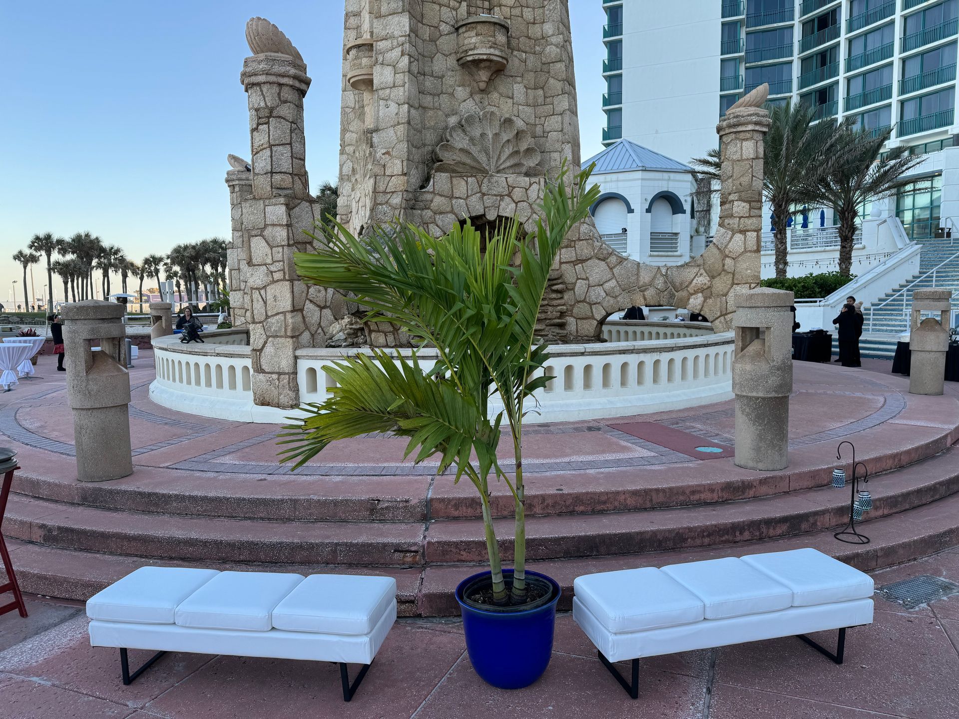 Blue and white hightop tables with a dj at a beach themed event 