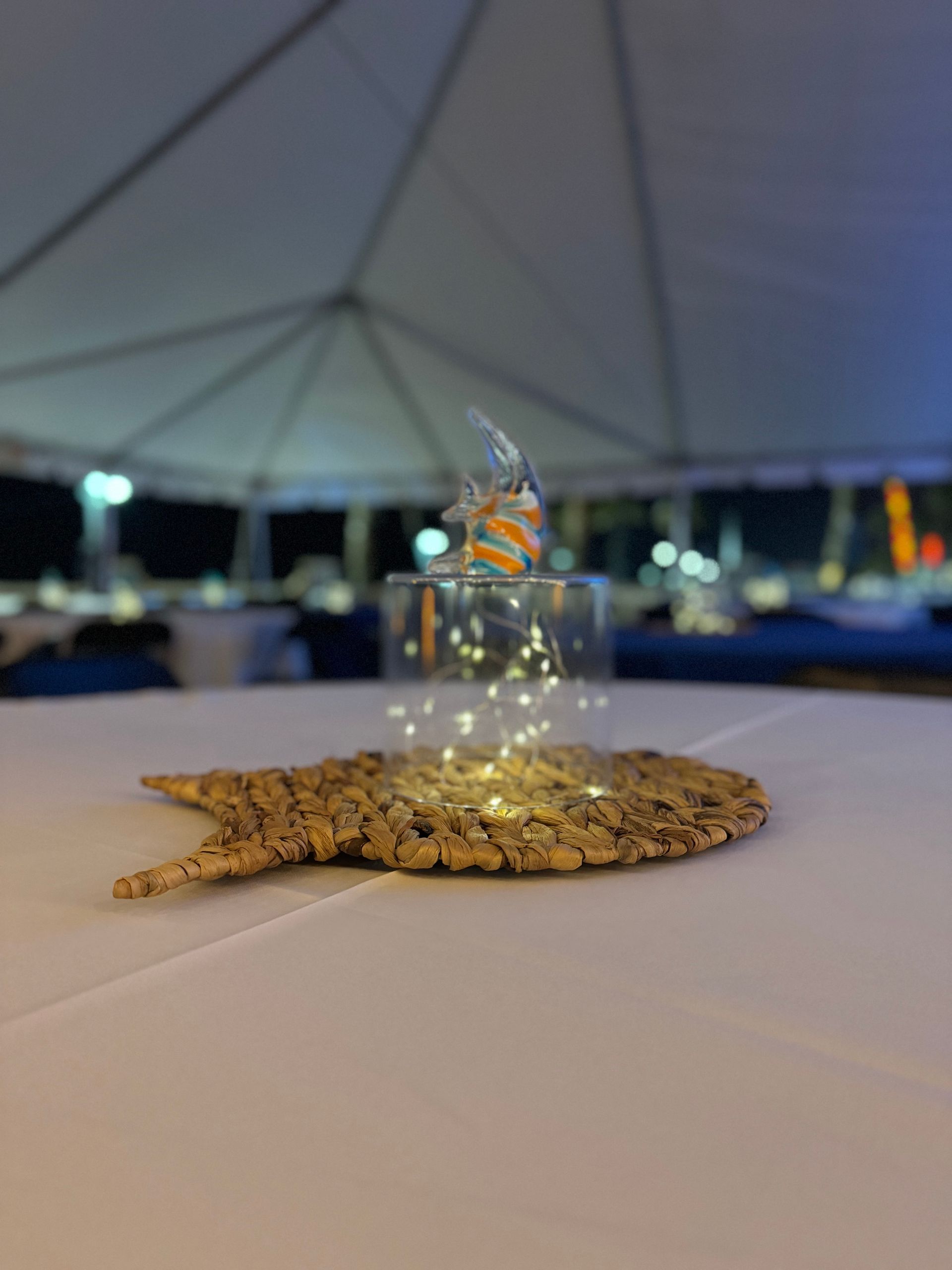 Beach themed centerpiece with glass fish for table set 