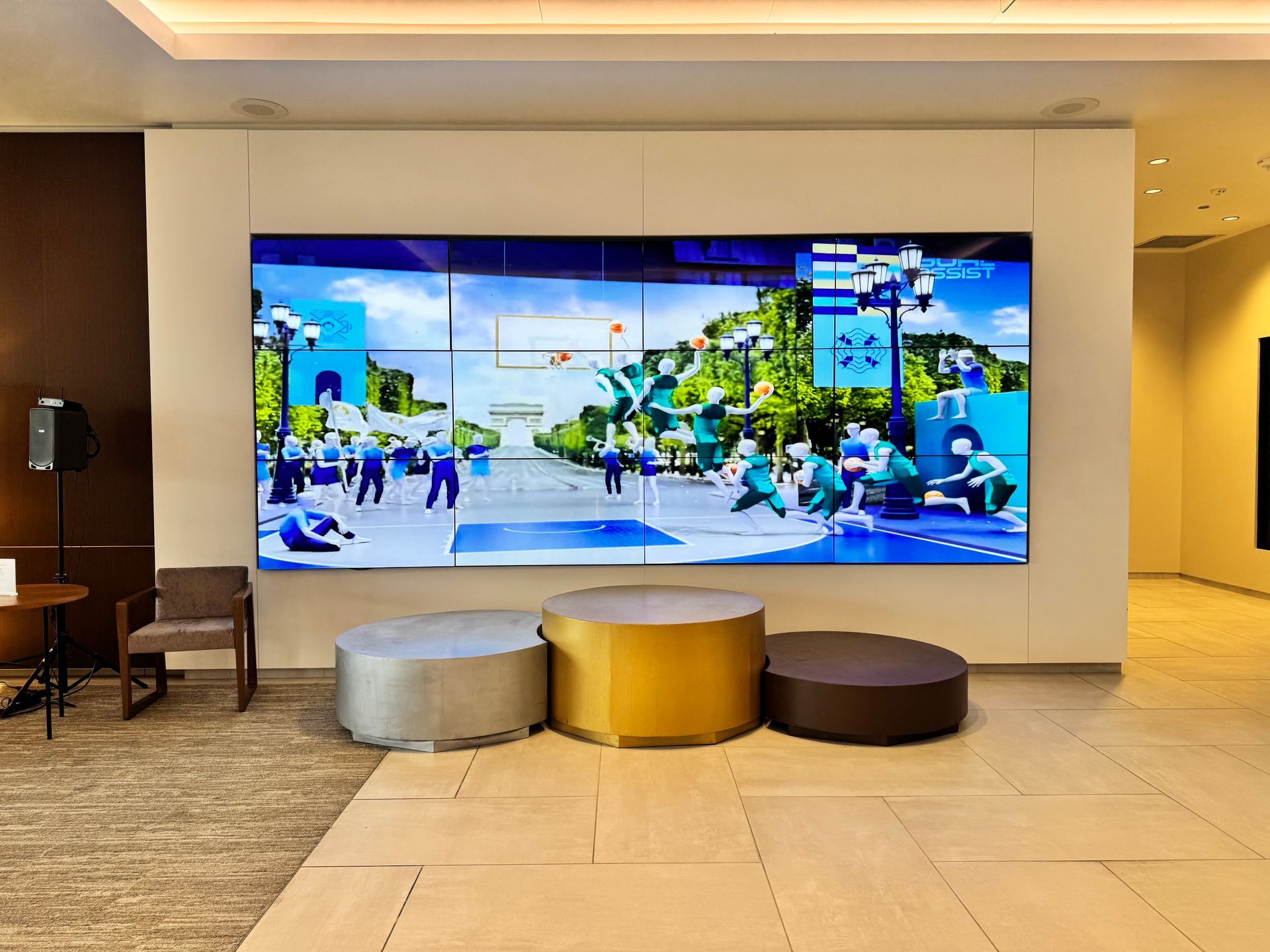  Large screen displaying animated basketball scene with Parisian backdrop.