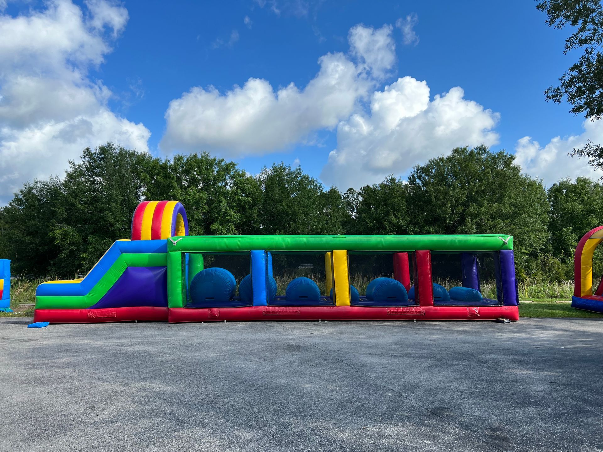  Side view of an inflatable obstacle course with jumping platforms.