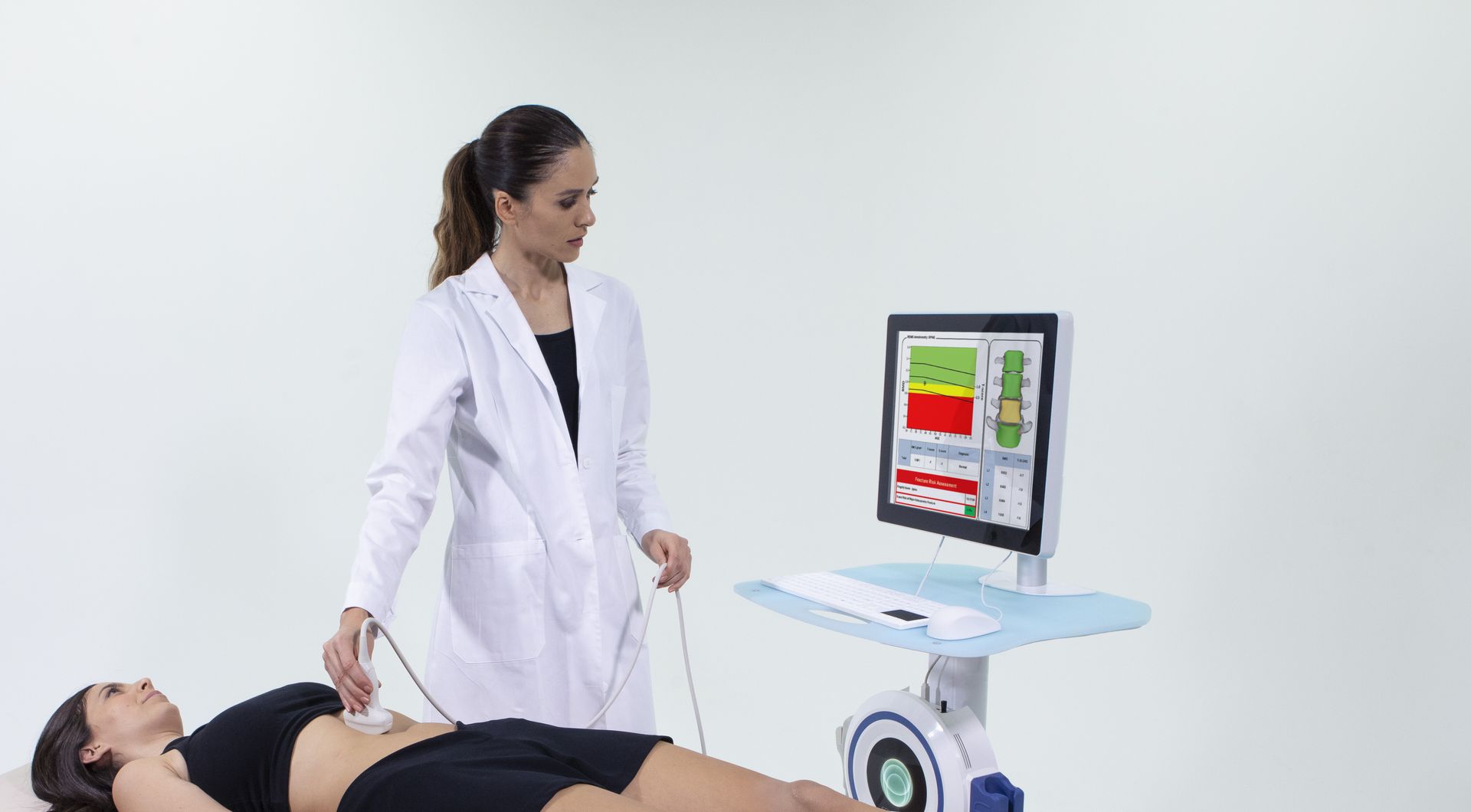 A woman is being examined by a doctor while laying on a bed