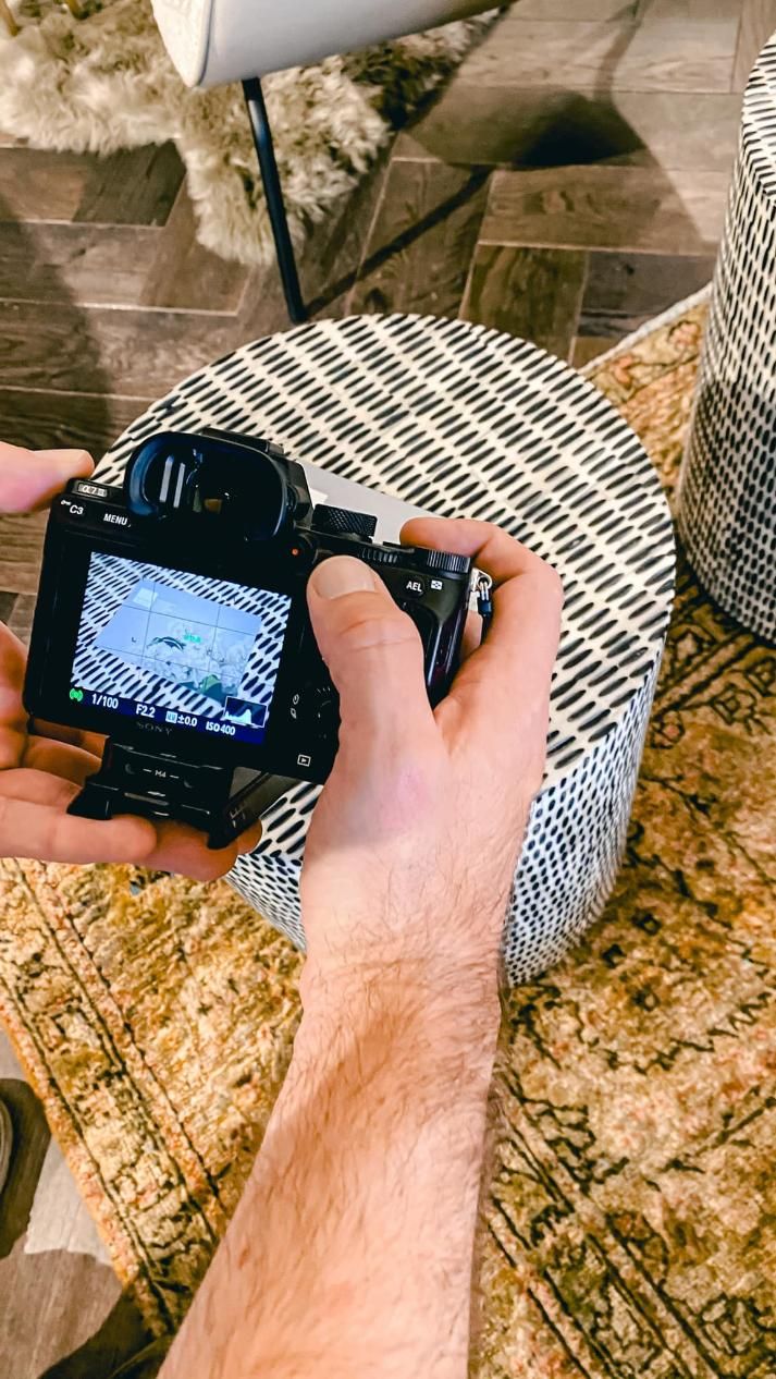 A Person is Taking a Picture With a Camera — Gem Socials In Port Macquarie, NSW