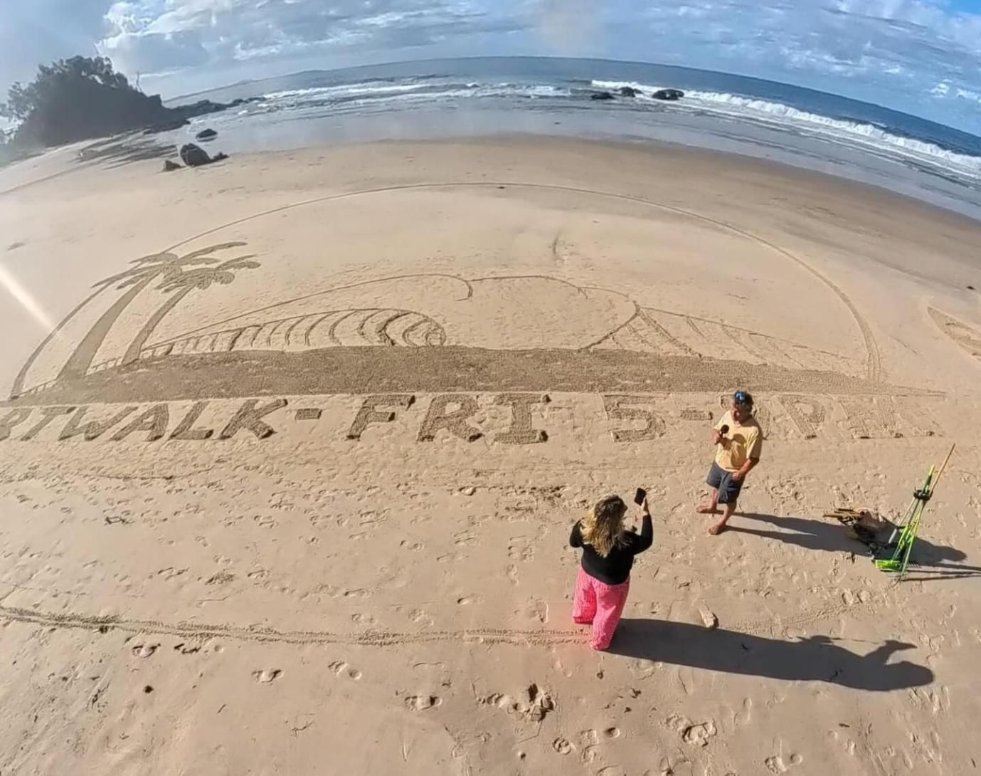 A Couple of People Standing on a Beach — Gem Socials In Port Macquarie, NSW