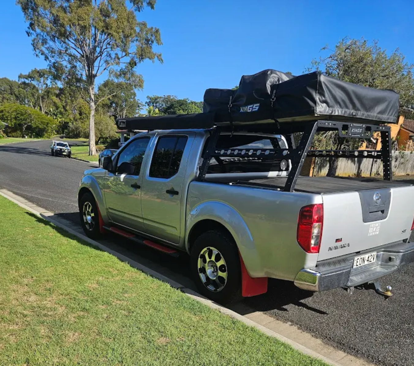 A ute is parked on the roadside surrounded by trees — East Lismore Automotive in East Lismore, NSW