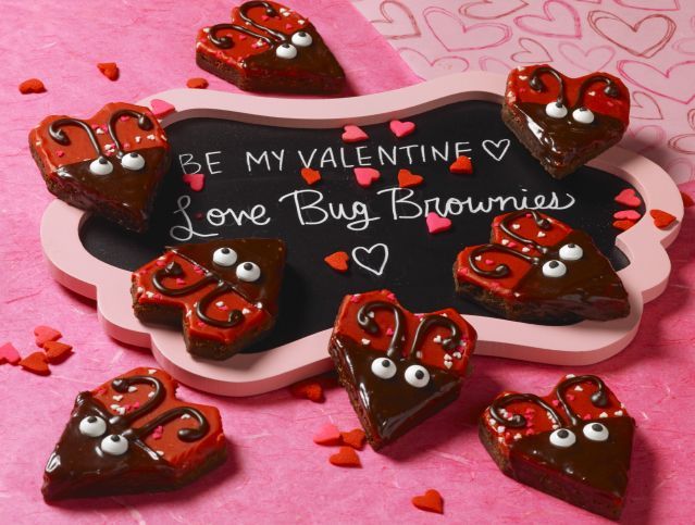 valentine brownies decorated as love bugs with icing and candies