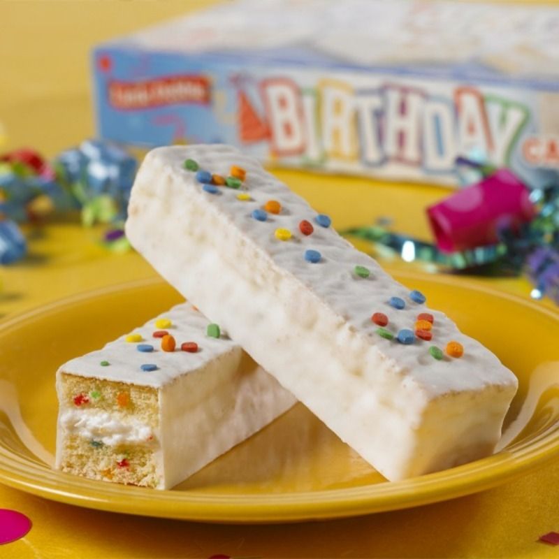 A yellow plate with two birthday bars on it