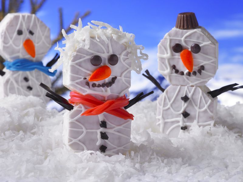 fancy cakes decorated as snowmen