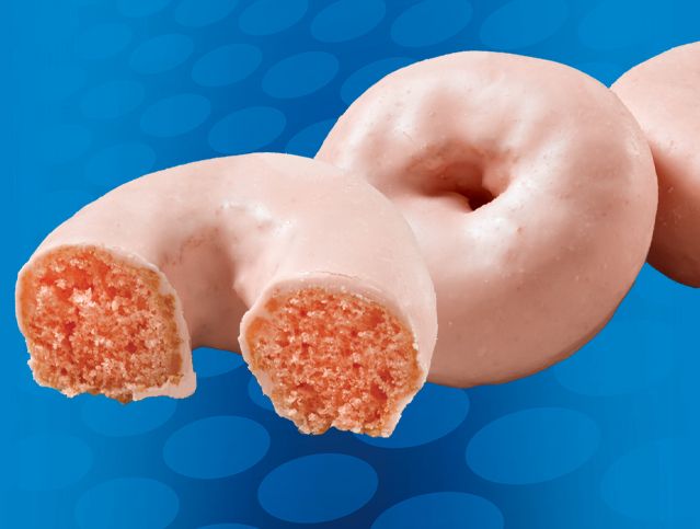 three strawberry shortcake mini donuts with one missing a bite