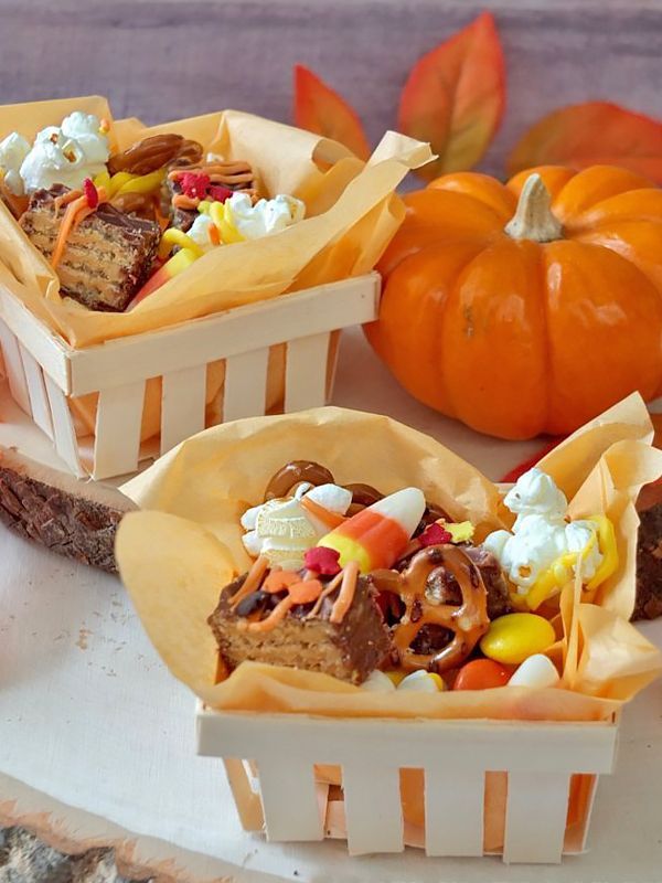 a festive basket filled with nutty buddy wafer bars, popcorn and candy corn