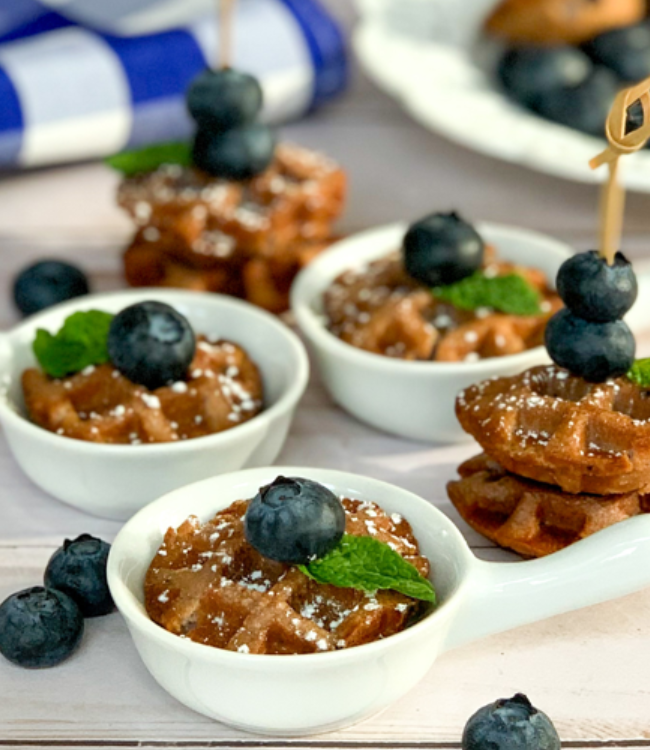 close up of blueberry mini muffins as waffles topped with fresh blueberries