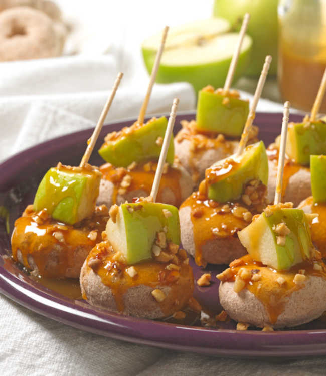 pumpkin spice donuts topped with apples and caramel sauce
