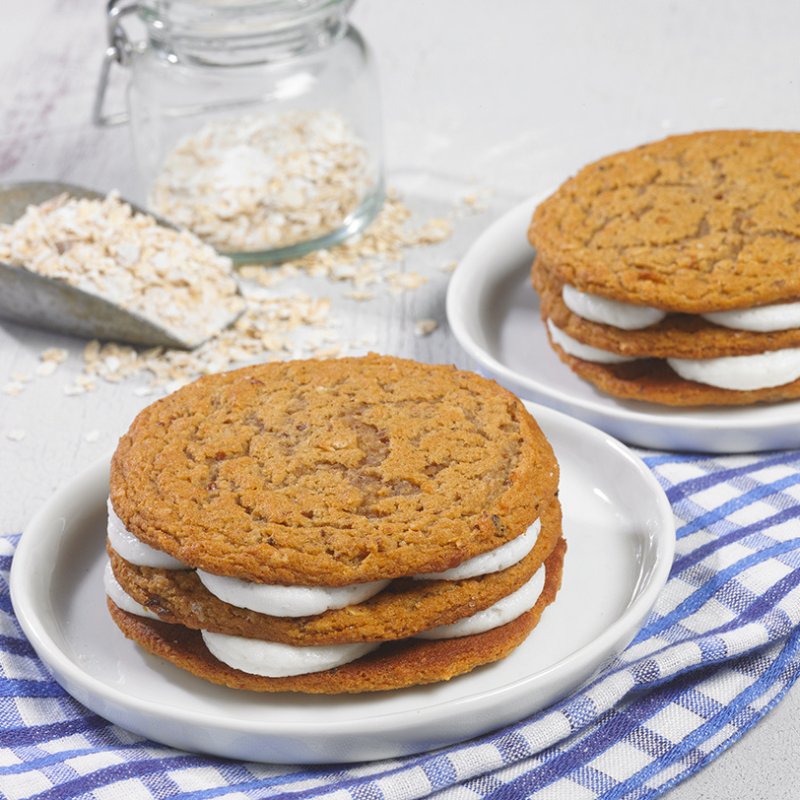 Two cookies stacked on top of each other on a plate