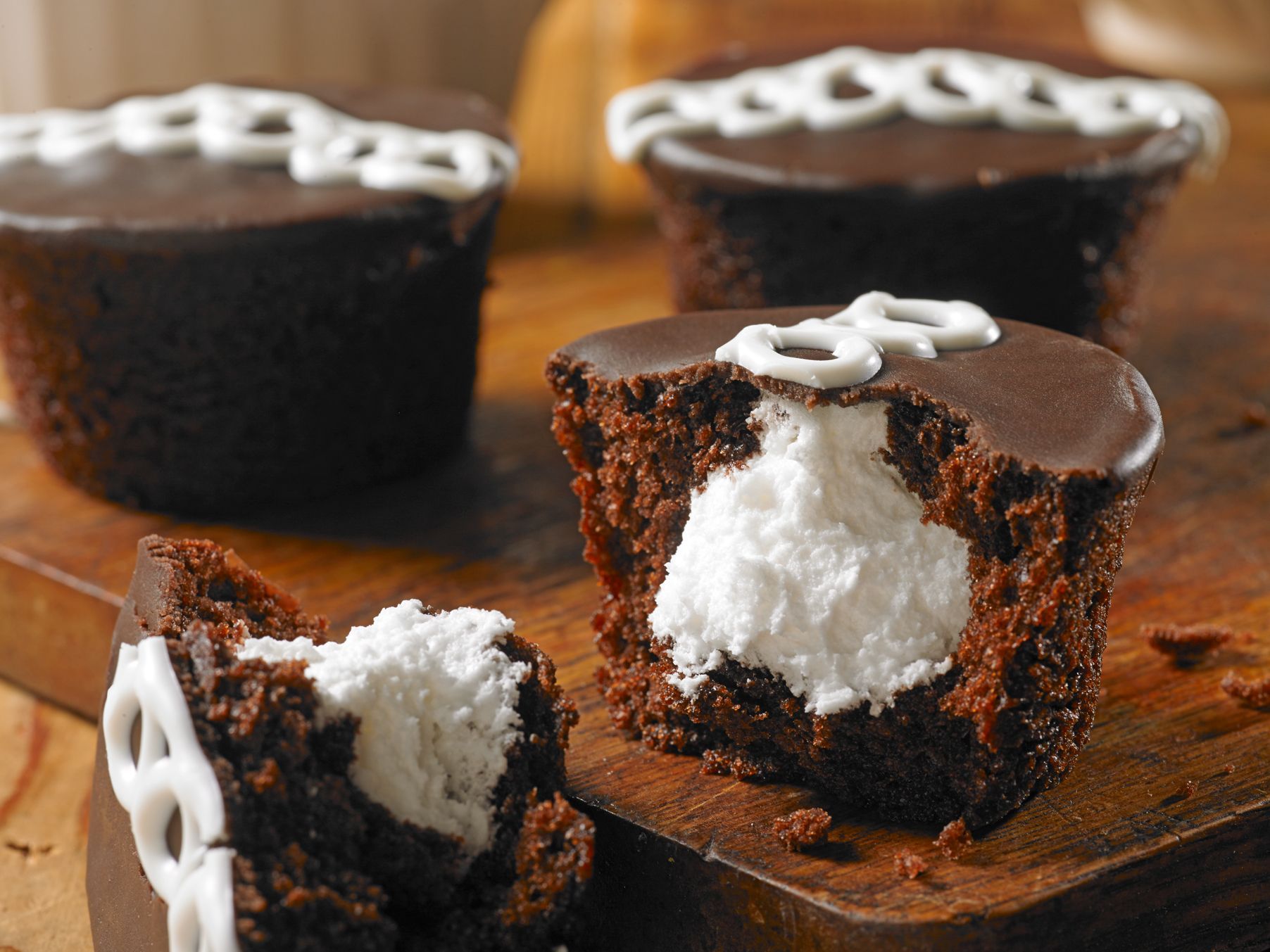a chocolate cupcake with a bite taken out of it