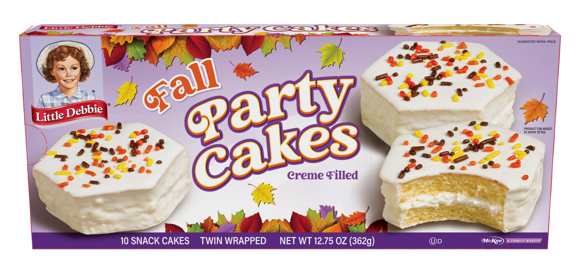 A box of fall party cakes with pumpkins and sprinkles