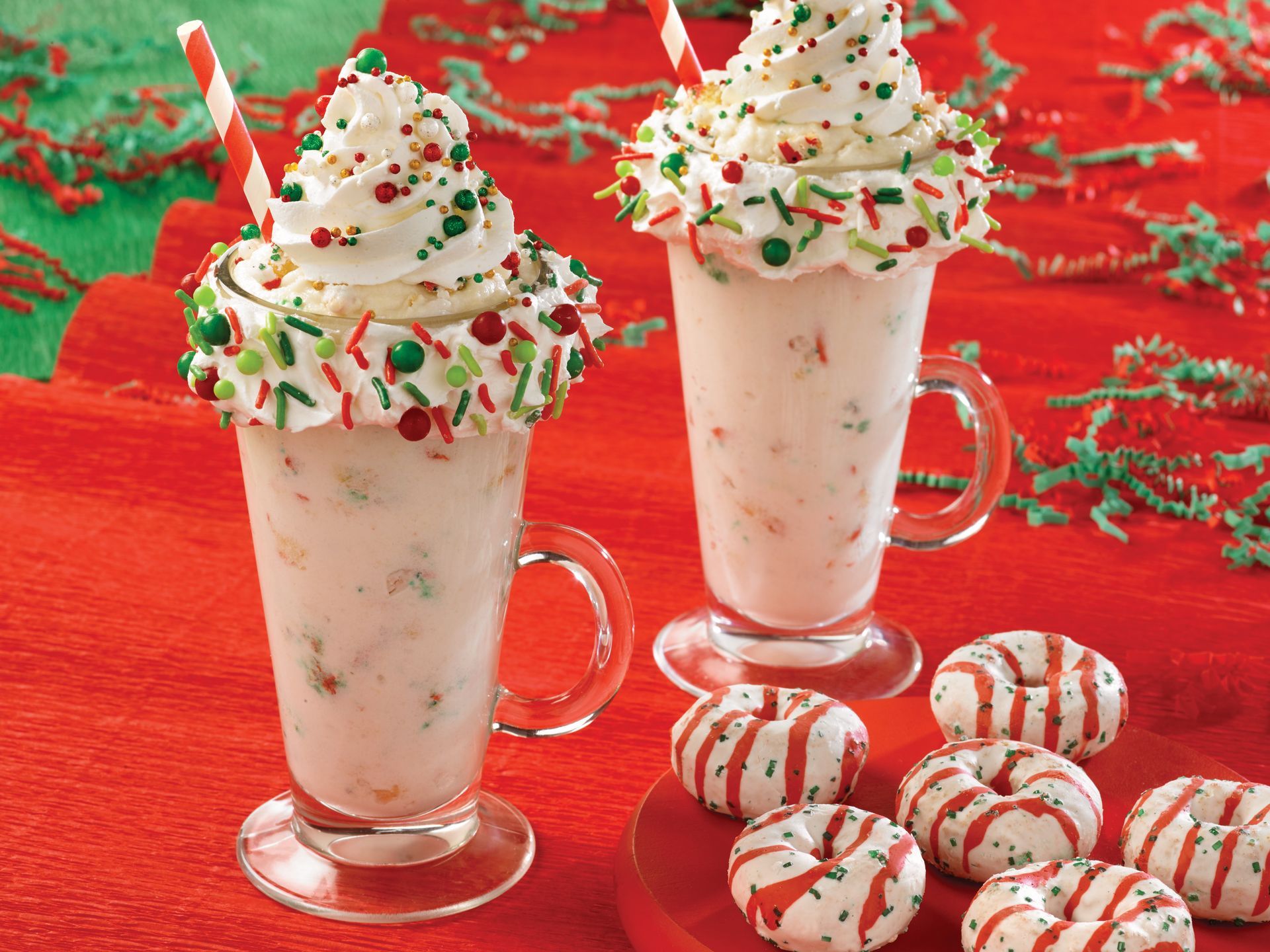 christmas mini donut milkshakes topped with sprinkles and whipped cream