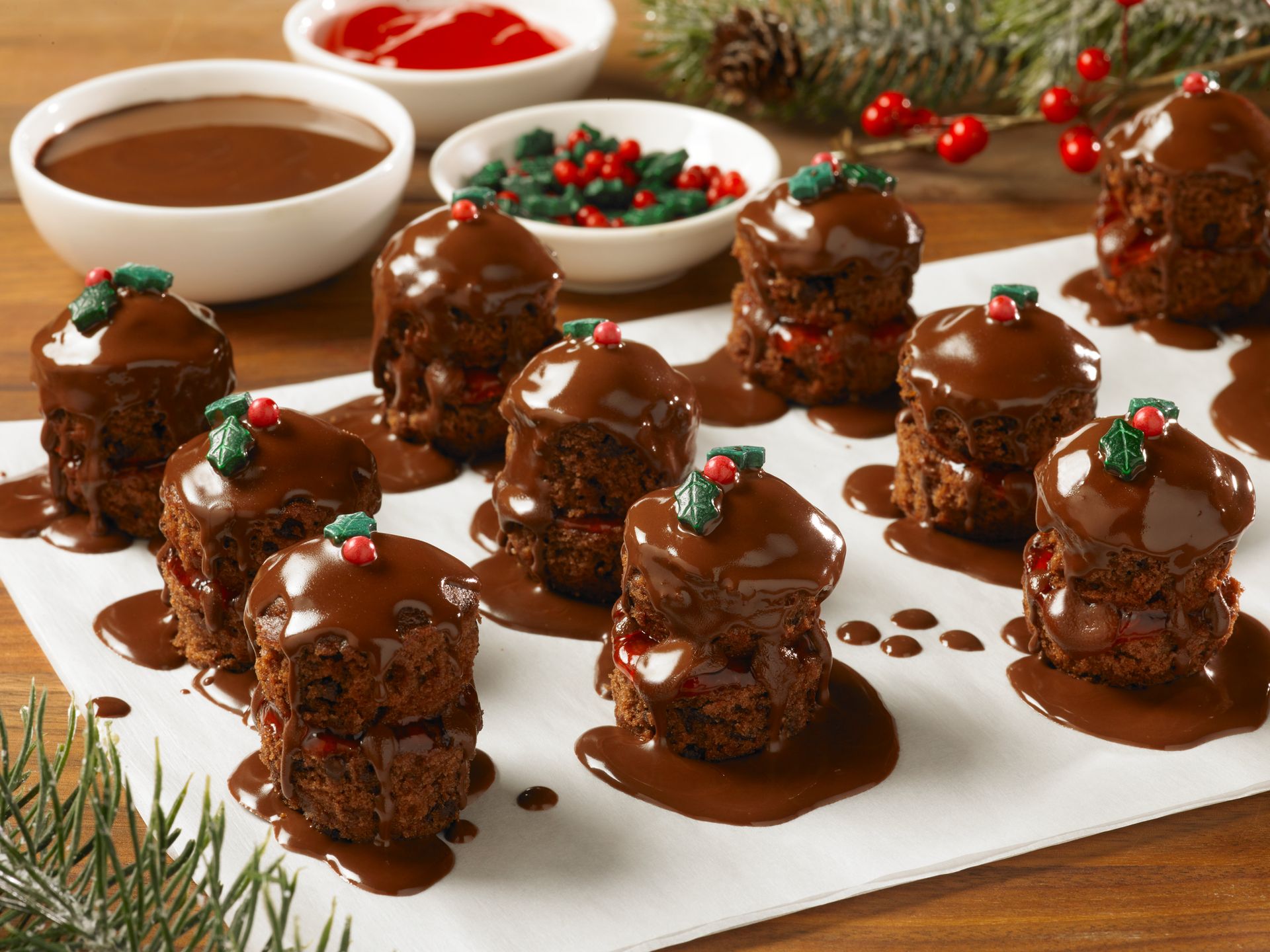 cosmic mini muffins decorated as petit fours with melted chocolate and holiday sprinkles