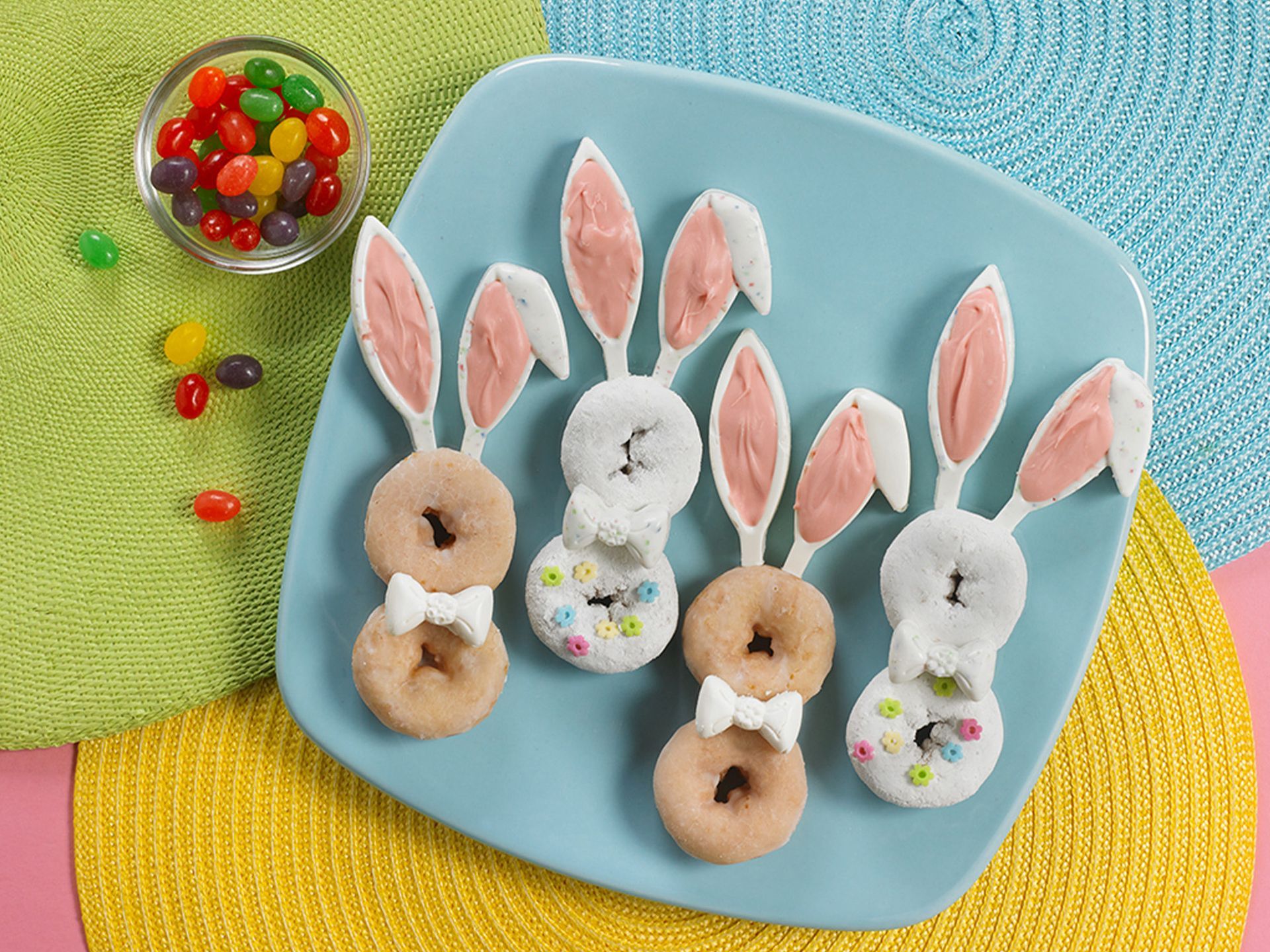 glazed and powdered mini donuts decorated to look like easter bunnies