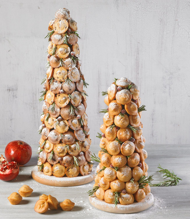 mini muffins decorated as christmas trees with rosemary, powdered sugar and pomegrantes